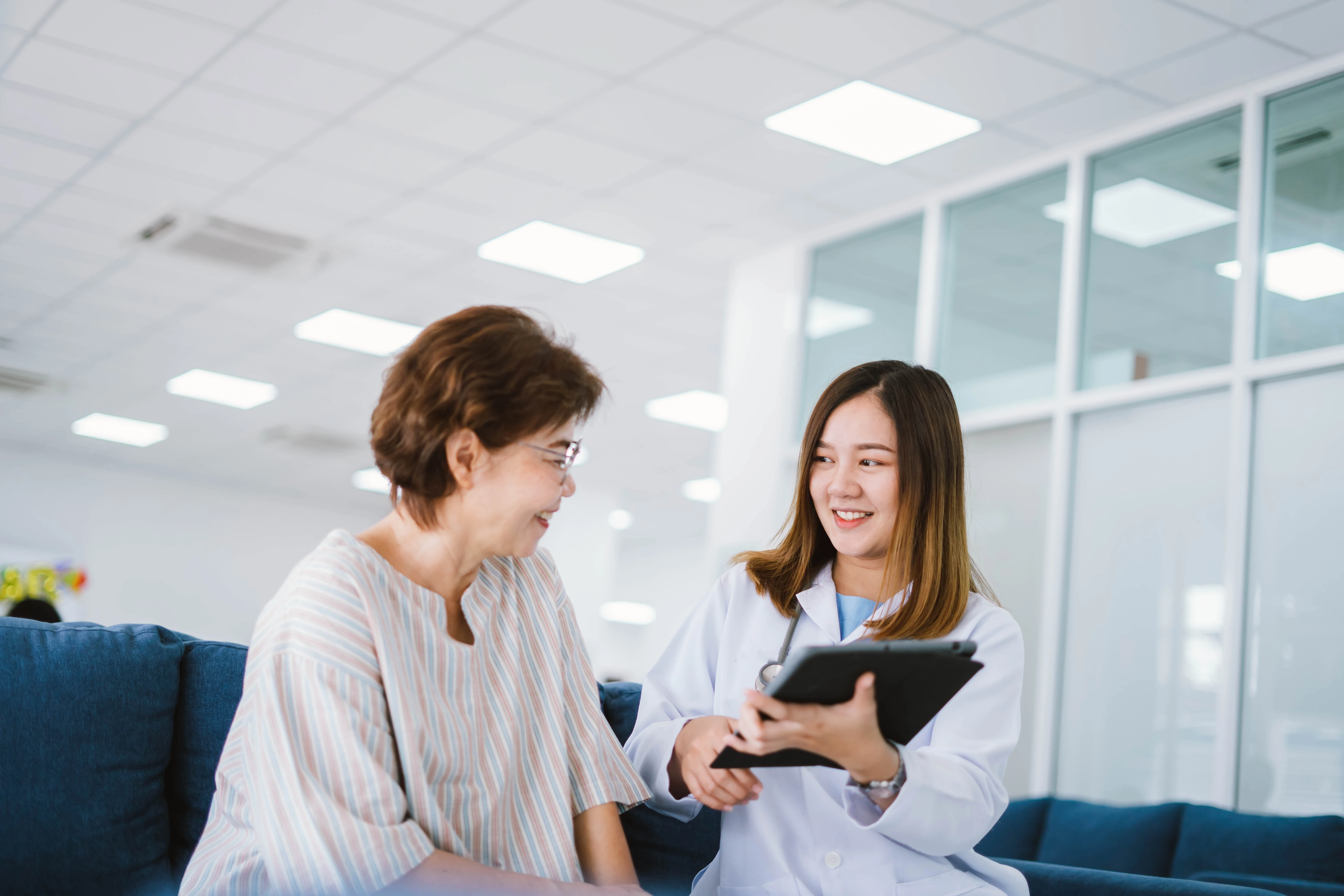 Doctor reviewing medical records with patient